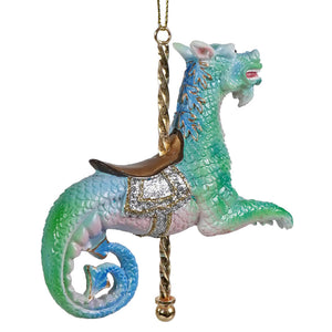 Sea monster carousel ornament featuring a colorful iridescent dragon ornament with glittery silver saddle and gold accents