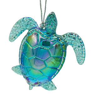 Iridescent blue and green glass sea turtle ornament with a textured faceted shell perfect for sparkle scallop shell decor