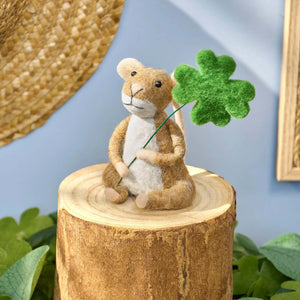 A charming brown and white felt shamrock mouse critter holding a green four leaf clover for st patricks day decor