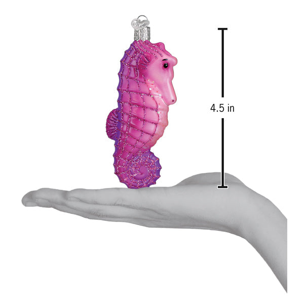 Shimmering pink and purple gradient glass bright seahorse ornament with silver cap measuring 4.5 inches tall