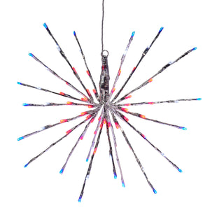 Starburst-shaped decoration made of black, red and blue lines radiating from a central point.