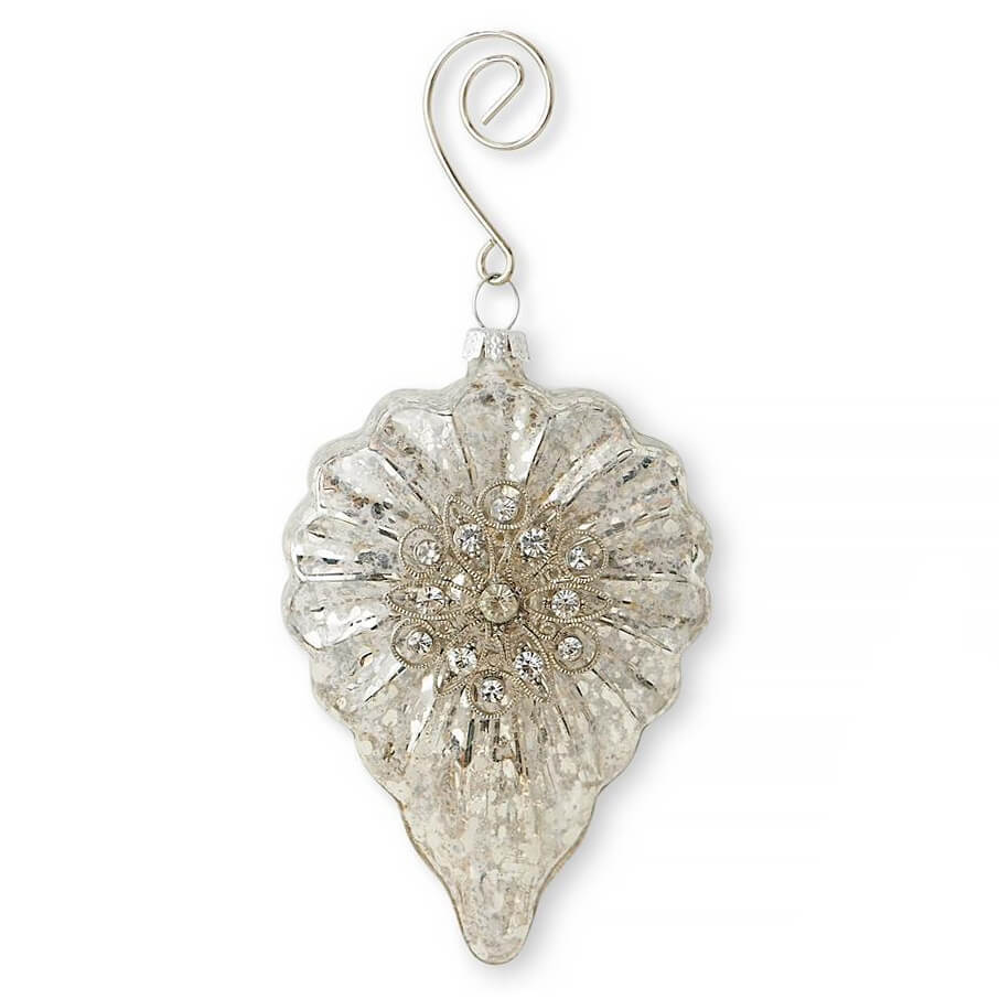 Ornate silver glass Christmas ornament shaped like a teardrop with a floral design.