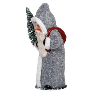 Silver santa holding tree figurine with ino schaller white fur trim carrying green christmas tree and red sack