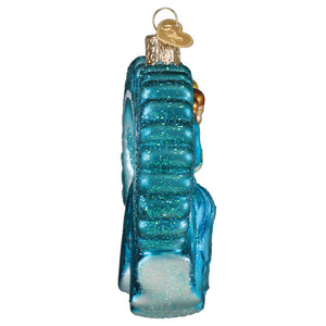 A translucent blue glass seahorse ornament with glitter texture and gold cap from sisters sisters collection