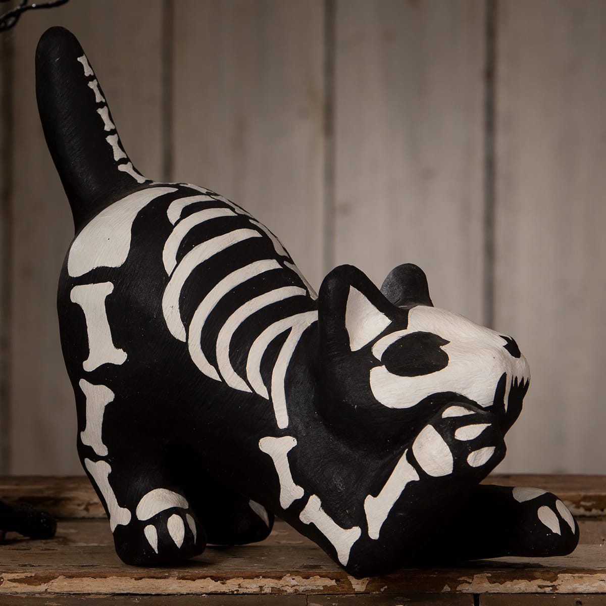 Black skeleton paper mache cat figurine with white festive skeleton decor perfect for halloween cats display