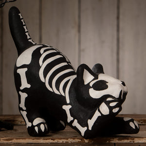 Black skeleton paper mache cat figurine with white festive skeleton decor perfect for halloween cats display