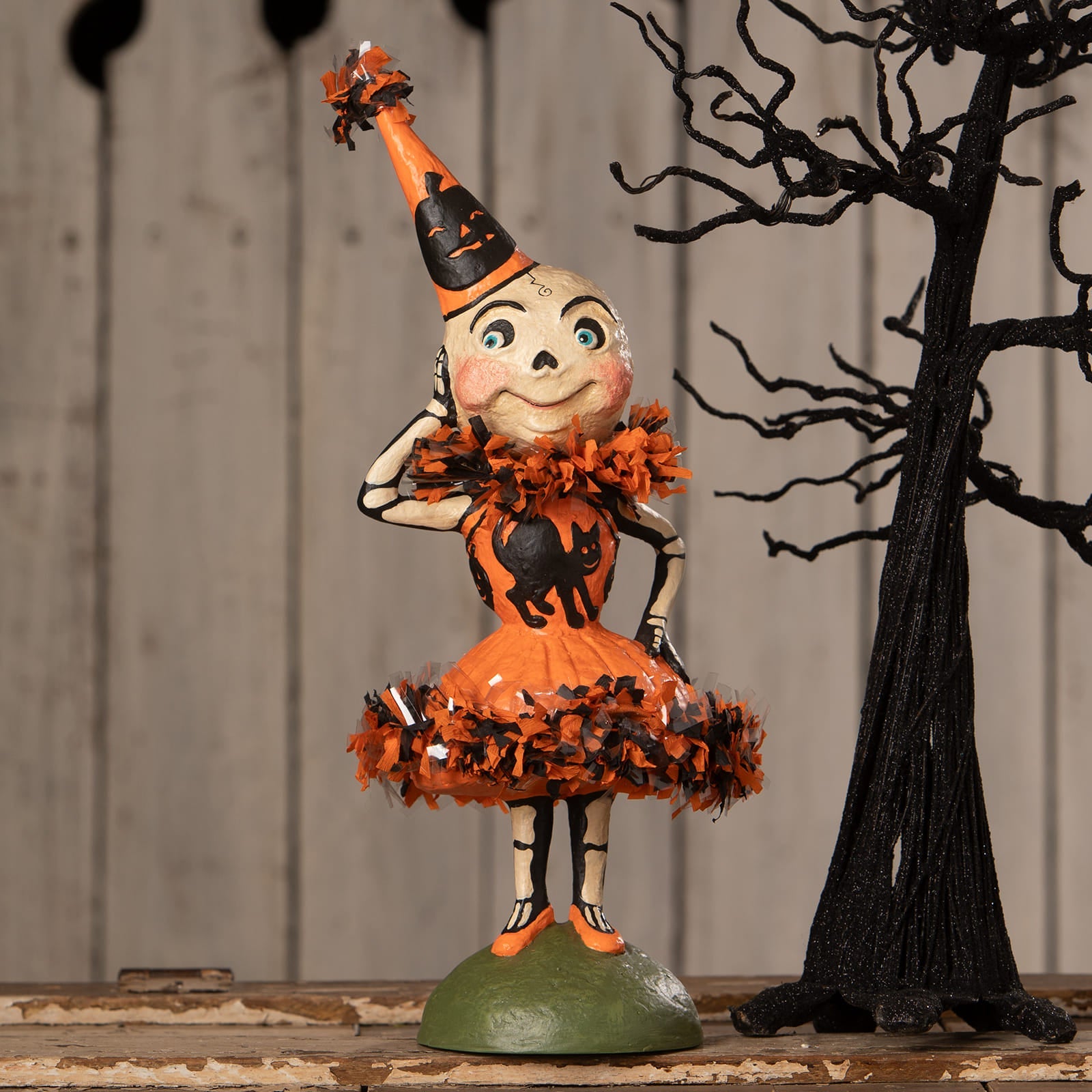 Skelita skellington skeleton decor figure in orange and black with smiling skull, party hat, and cat dress by bethany lowe halloween figures and dolls