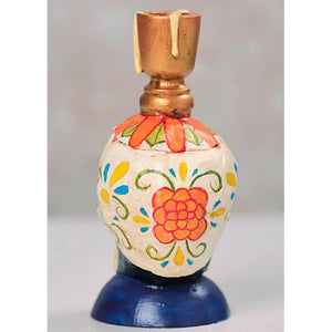 Decorative perfume bottle with floral folk art patterns painted in orange, yellow and blue.