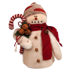 A cream-colored plush skicap snowman holding candy with a red scarf and striped knit hat spreading holiday cheer
