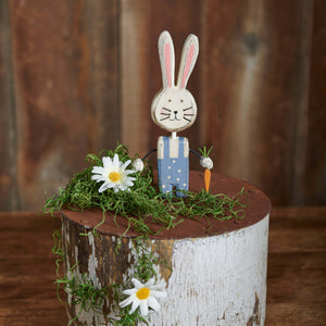 Skippy bunny chunky wooden bunny chunky sitter with pink ears blue polka-dot overalls on mossy log with tiny carrot details