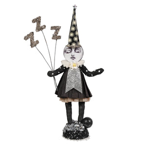 A whimsical black and silver glittery sleeping moon girl figure holding three z balloons with a star party hat