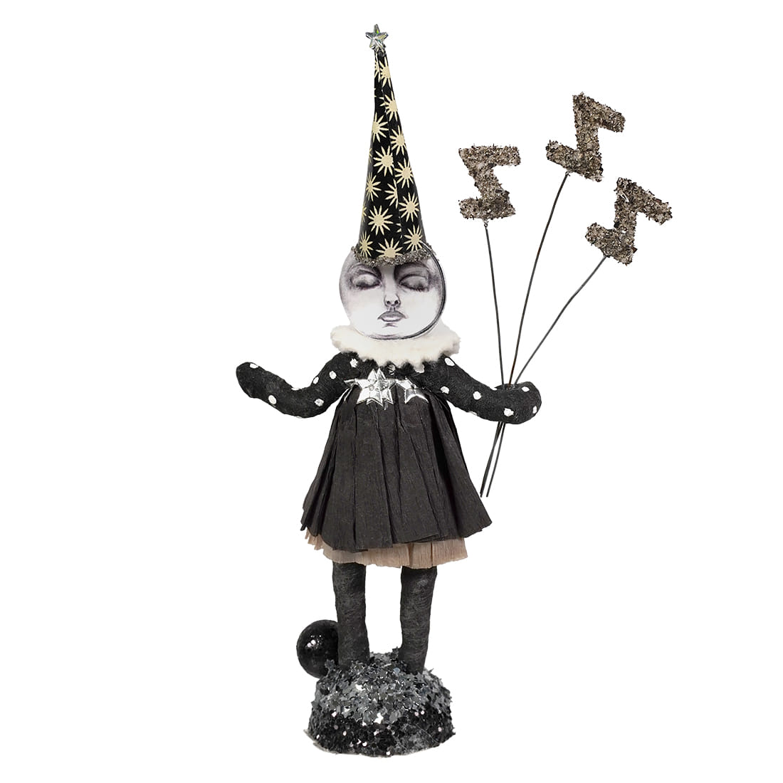A whimsical black and white sleeping moon girl figure with a star party hat holding glittery zigzag balloons