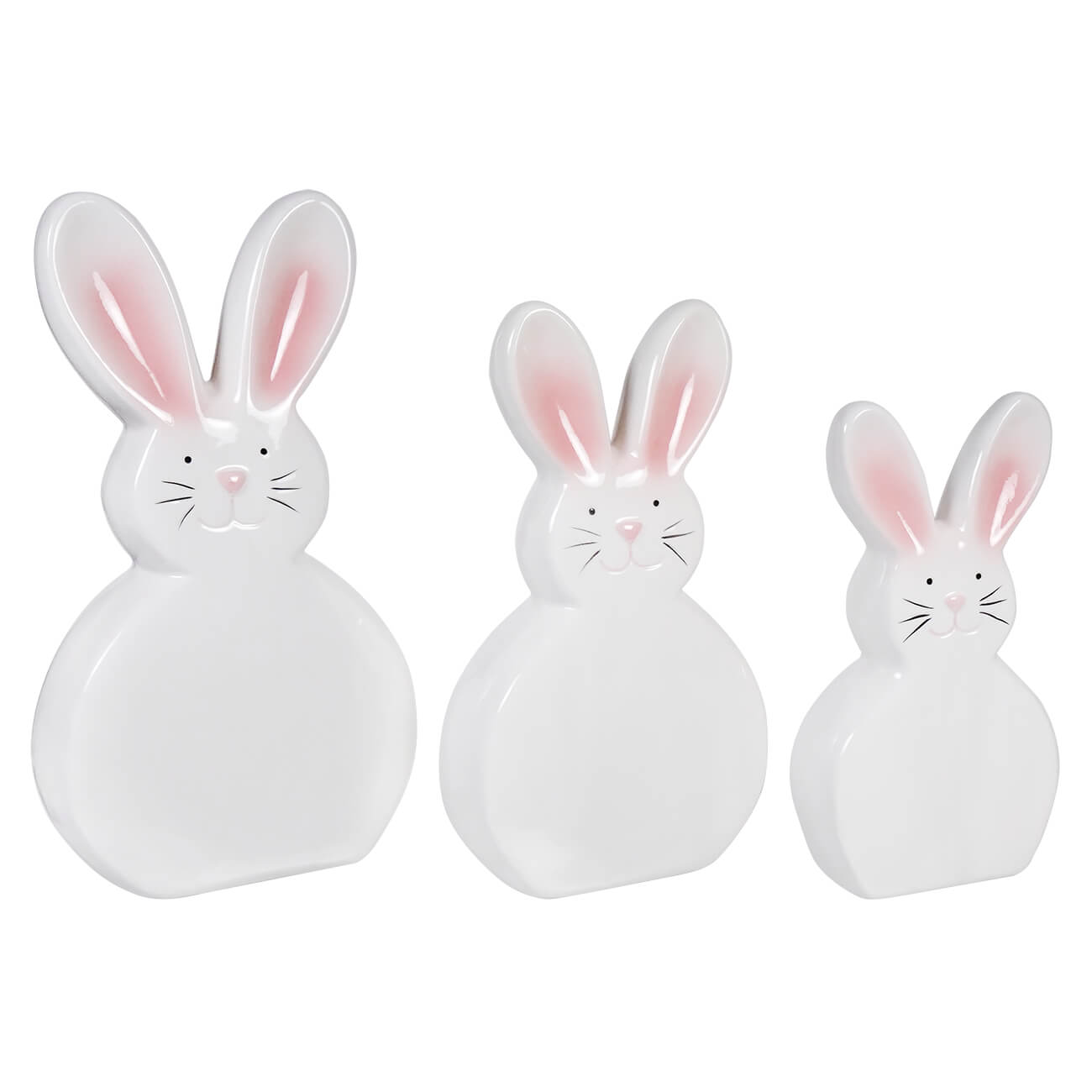 Three white ceramic bunnies with pink ears and whisker details arranged in a row.