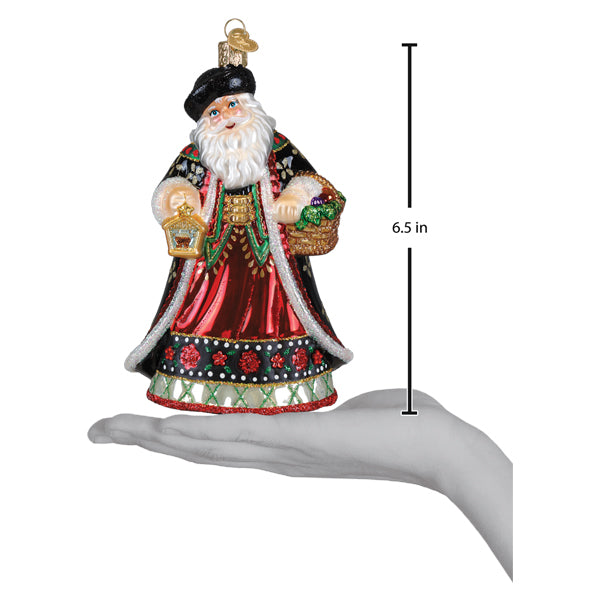 Festive slovak father christmas glass ornament with santa in red and black robe holding lantern and fruit basket