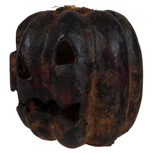 Small black oval carved pumpkin with weathered dark brown finish and moss detail perfect for rustic tabletop decor