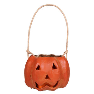 Small carved orange pumpkin bucket made of ceramic with raggedy junction design and a woven rope handle handcrafted folk art