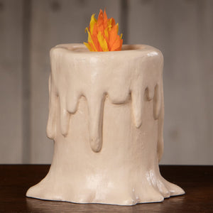 Cream-colored ceramic small flam’in candle luminary with faux orange and yellow flame decoration
