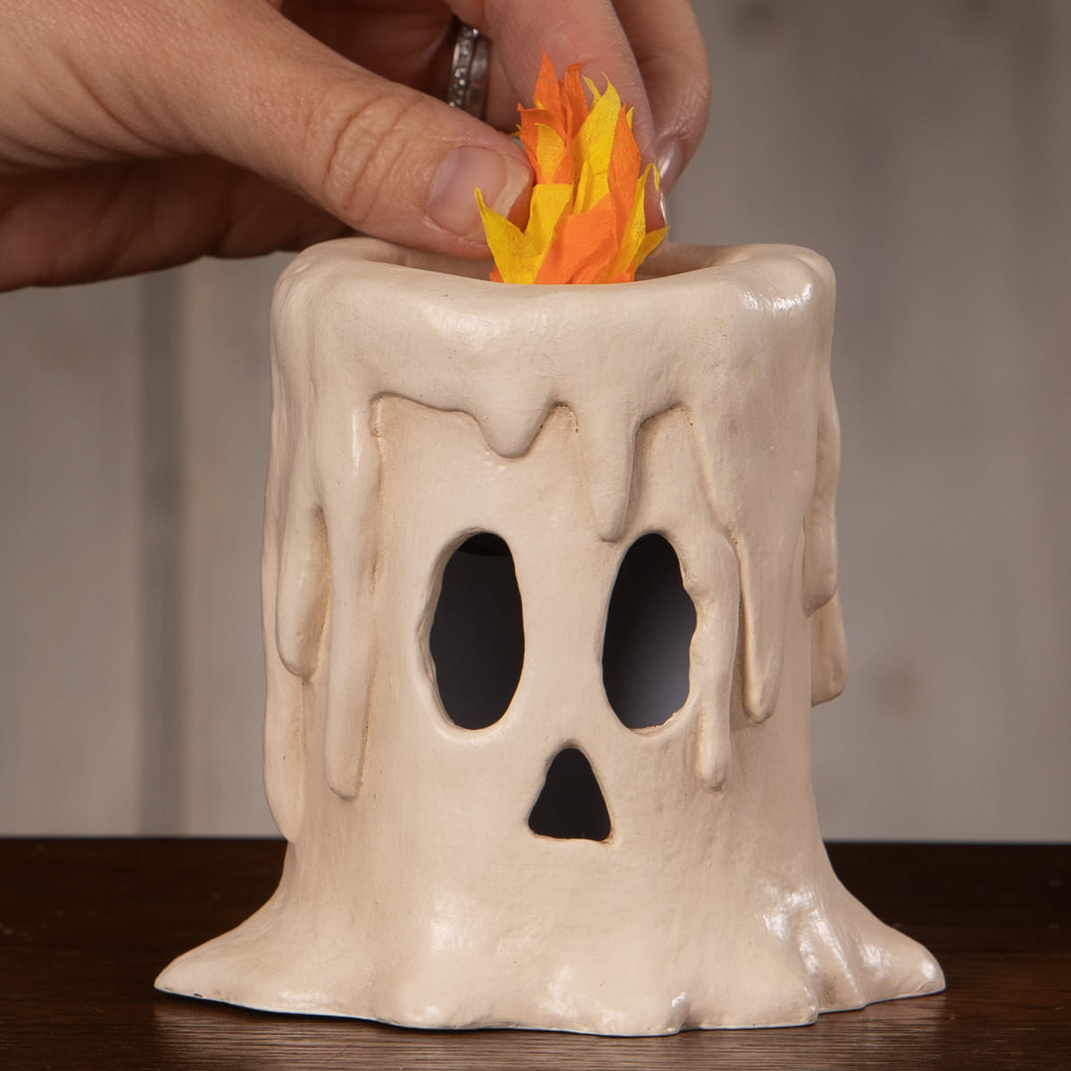 Small flam’in candle luminary ceramic cream ghost with black cutouts and orange yellow paper flames candle luminary