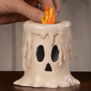 Small flam’in candle luminary ceramic cream ghost with black cutouts and orange yellow paper flames candle luminary