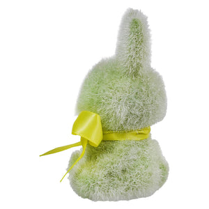 Plush green bunny with a yellow ribbon bow tied around its middle.