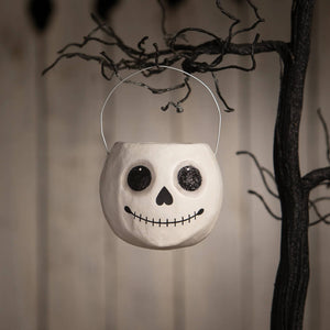 Small jolly skeleton bucket is a white skull-shaped halloween bucket with black glitter eyes perfect for halloween buckets and lanterns