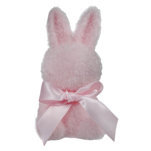 Pink plush bunny with a satin bow around its neck.