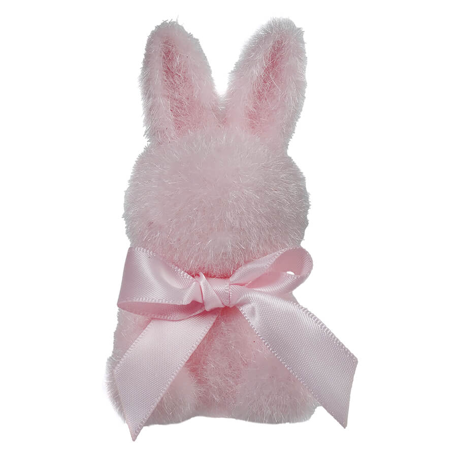 Pink plush bunny with a satin bow around its neck.