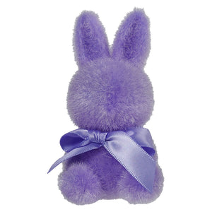 Purple plush bunny with a lavender satin bow around its neck.