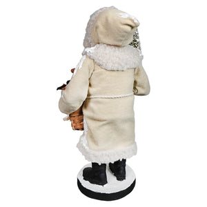 Cream-colored plush small santa with white fur trim black boots on circular base from bethany lowe designs santa figures