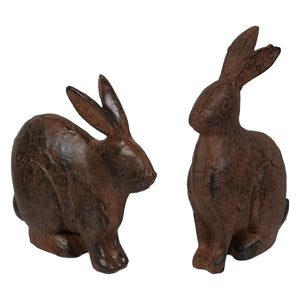Two rustic brown cast iron bunnies set featuring vintage easter bunny figural decor for easter and spring tabletop decor