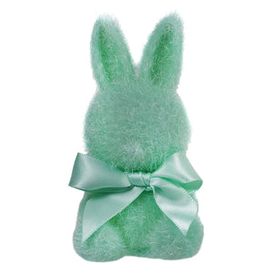 Mint green plush bunny with a satin bow around its neck.