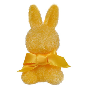 Yellow plush bunny with a satin bow around its neck.