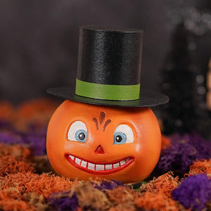 Orange smiling pumpkin container figurine wearing black top hat with green band perfect for jack o lanterns decor