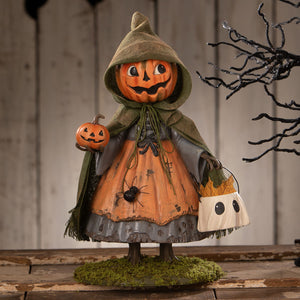 Smiling susie pumpkin figurine by bethany lowe with orange pumpkin head green cloak holding jack o lantern and ghost bag