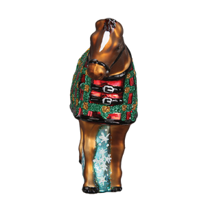 A glossy brown glass snowflake horse ornament with a festive red and green glittery plaid blanket figural decor