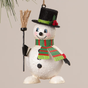 A charming white snowman ornament with a black top hat and striped scarf holding a broomstick by bethany lowe design