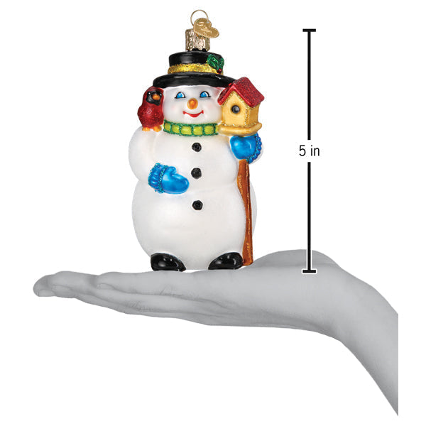 Gleeful snowman figural decor white glass ornament with black hat blue mittens green scarf holding cardinal and birdhouse