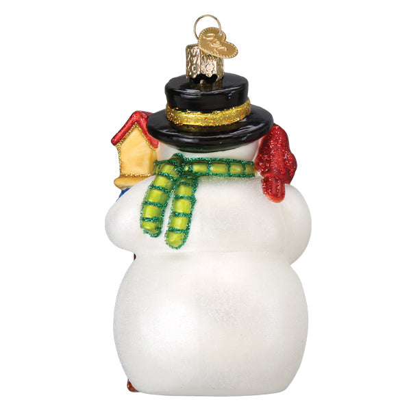 White glass gleeful snowman ornament with black top hat, green glittery scarf, red gloves, and figural decor style