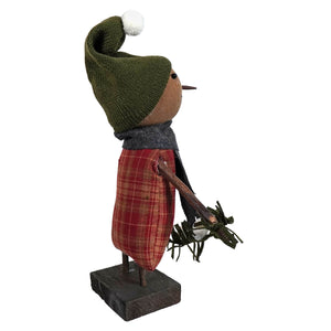 A rustic handcrafted snowy sarah snowman with a knitted green hat and red plaid skirt by kari emerson design christmas snowman figures decor