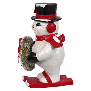 A festive white snowman figurine with glittery texture wearing a black top hat and red scarf from bethany lowe designs snowy slopes frosty