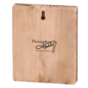 Wooden plaque or sign with ’Primitives by Kathy’ text from Lancaster, Pennsylvania.