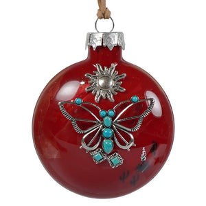 Red handcrafted glass ornament featuring a silver butterfly with turquoise stones and sun motif southwestern style