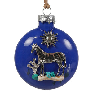 Blue glass southwestern horse christmas ornament with silver horse sun and cactus design and turquoise accents
