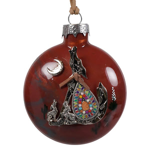 Red glass southwestern howling wolf christmas ornament with silver wolf howling at the moon and colorful gemstones