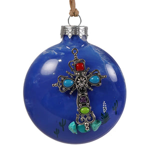 A vibrant blue southwestern jeweled cross christmas ornament with an ornate silver cross and colorful gemstones
