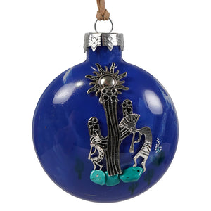 A southwestern kokopelli cobalt blue glass ornament with silver cactus and sun design accented by turquoise stones