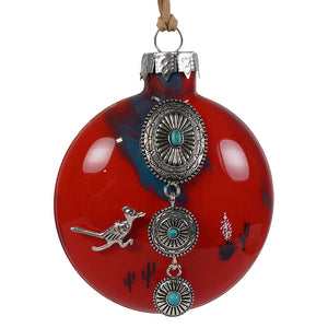A southwestern roadrunner christmas ornament in red glass with silver southwestern-style charms and turquoise stones