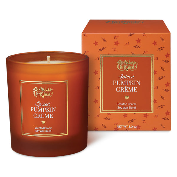 Amber glass spiced pumpkin creme candle with gold-trimmed label and white wick from old world christmas by creative co-op