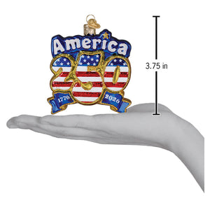 Blue and red glass spirit of 76 to 26 ornament with gold trim celebrating americas 250th anniversary design