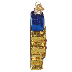 Blue and gold glass ornament shaped like a vintage suitcase with metallic accents for celebrating americas 250th anniversary